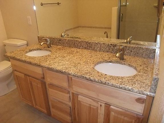 Granite in all baths.
