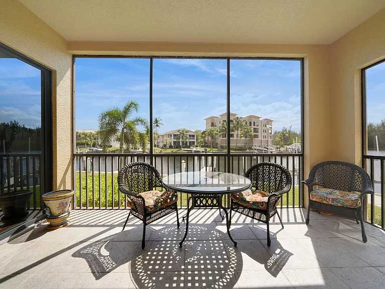 Lanai and and dining furniture. A settee, coffee table, and ceiling fan have been recently added
