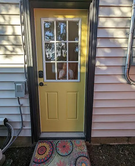 Entrance into living area near gate to alley parking