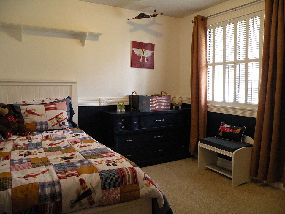 Bedroom with wood shutters