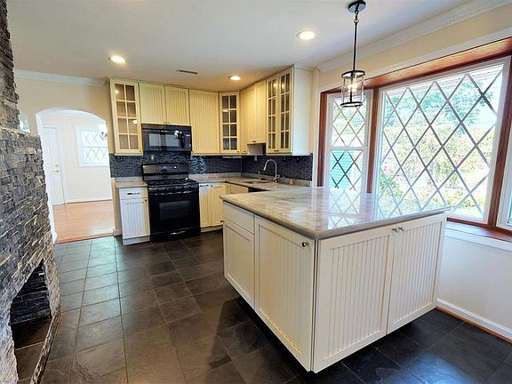 Updated kitchen boasting quartz counterops