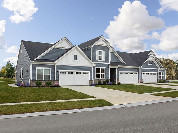 condo building with two units and front entry garages