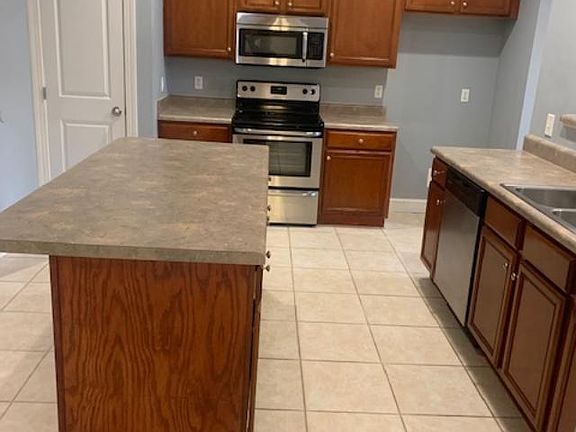 Kitchen with Stainless Steel appliances. Fridge to be included shortly.