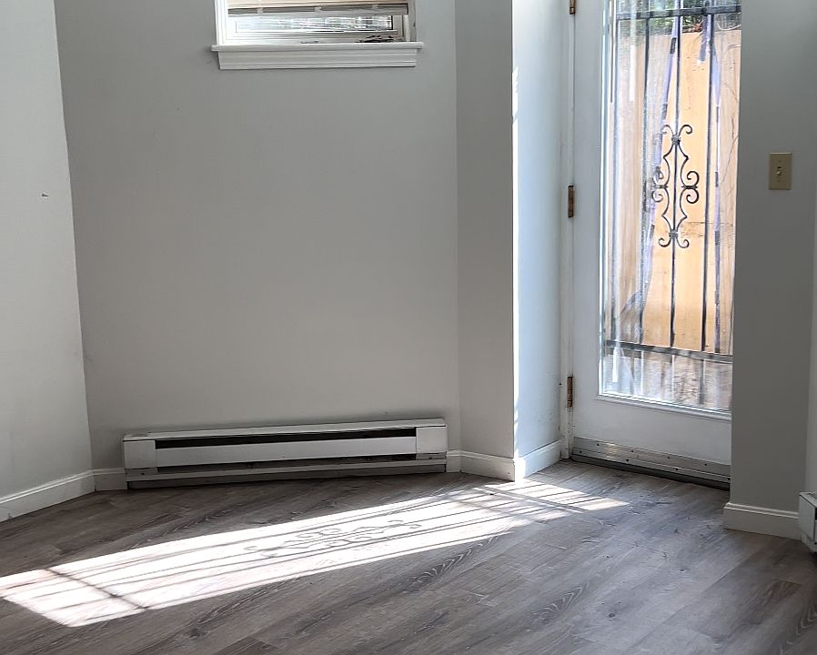 Living room space and patio door. Lots of natural light during the day.