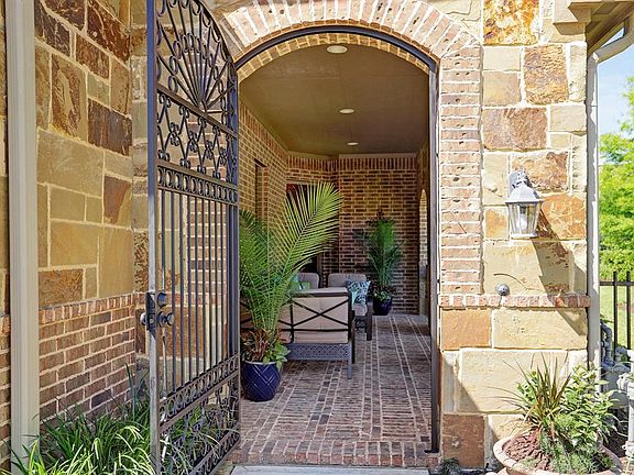 This front porch will greet your guests as they arrive. Great extra entertaining space or just a space for you to relax!