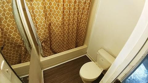 Bathroom # 2 with new flooring, floor trim