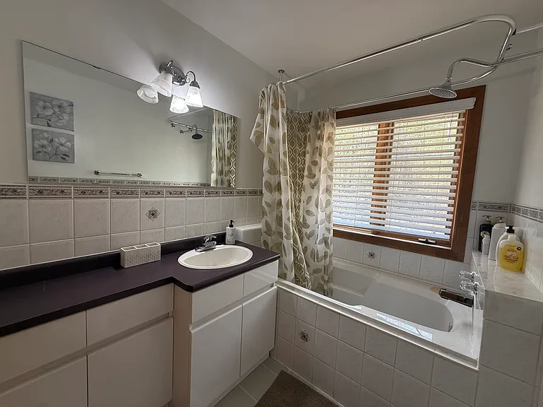 Second floor bathroom with tub