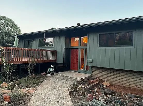 Private entry and front deck surrounded by nature