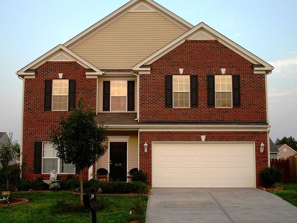 Beautiful Curb Appeal with Partial Brick Veneer.
