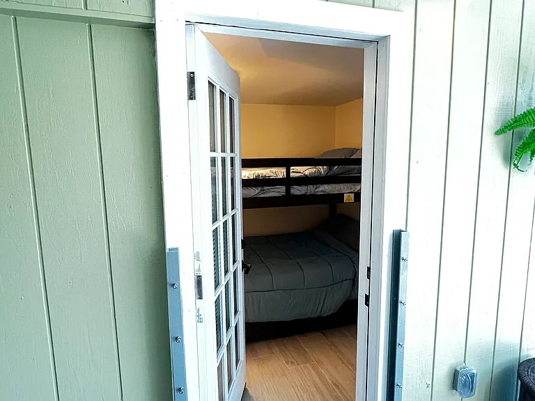 Door to third bedroom allowing pool access
