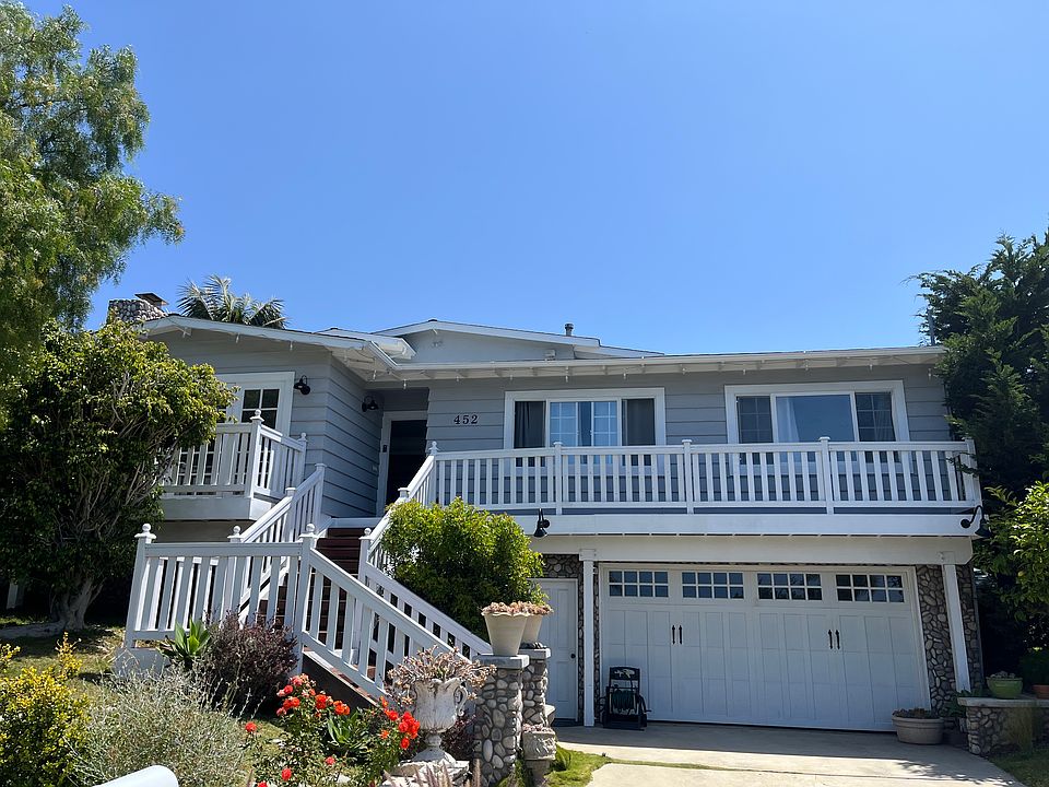House tucked into cul de sac with 2 large spaces for driveway parking.