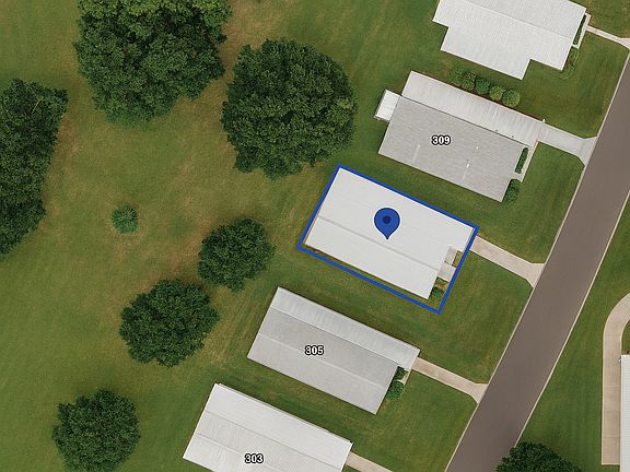 This aerial shows the greenspace behind home.