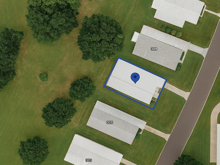 This aerial shows the greenspace behind home.