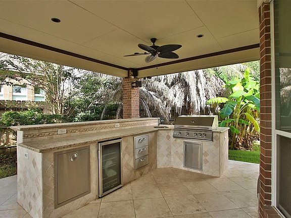 Custom Outdoor Kitchen with Grill, Wire Cooler, & Ready For A Party.