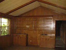 Spacious den with high ceiling with a great view of back yard.