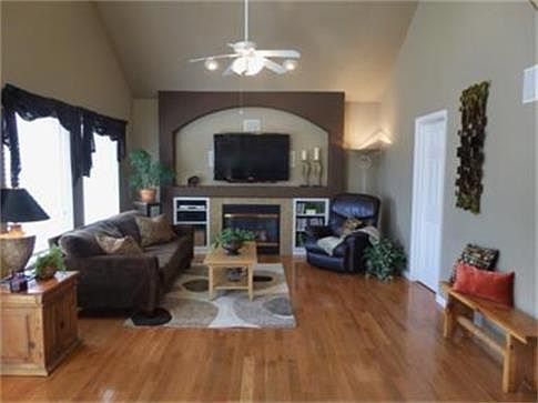 Family room has beautiful hardwood floors and gas fireplace