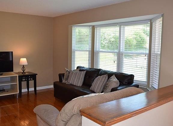 Enjoy the newer bay window along with fresh paint in the family room, and the gorgeous wood flooring!