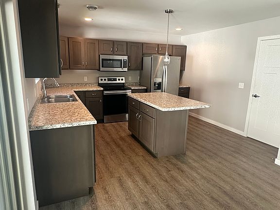 Open concept kitchen/dining/living