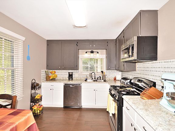 Updated kitchen - new dishwasher, fridge, microwave, sink and gas stove!