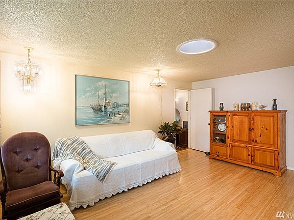 View of the living room with fresh paint and bamboo floors.