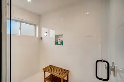 Master bathroom also contains a large dual-shower from the entryway on the left. The private toilet room is to the left of the shower