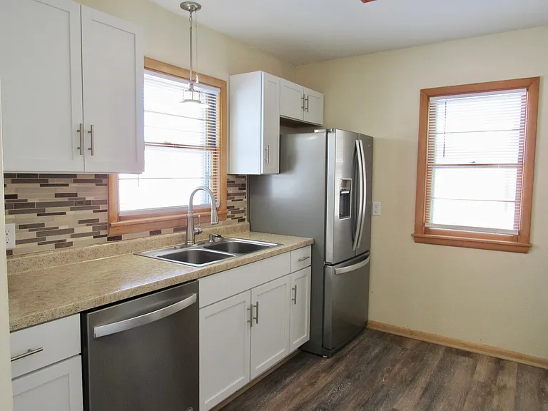 Kitchen- New fridge and Dishwasher. All new cabinets and counter tops with new sink and garbage disposal. New back splash throughout. New Vinyl Plank Flooring.