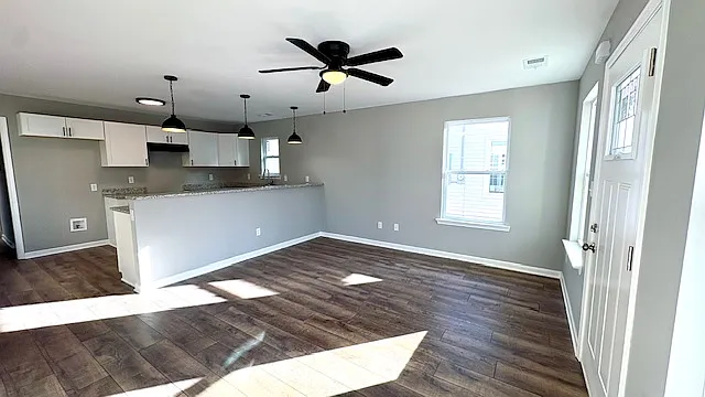 Sunny Yellow Renovated 3-Bedroom Home with Main-Level Primary Suite — Photo 2