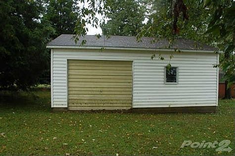 Home has huge 1 car detached garage with plenty of space for a workshop or storage.