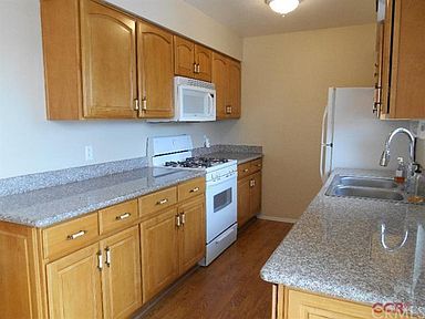 The efficient kitchen features lots of storage and a built-in microwave.