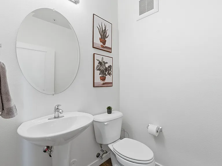 Convenient half bathroom for guests.