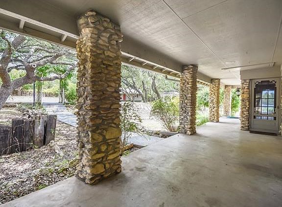 Large covered back patio perfect for your outdoor furniture looking out onto the pool.