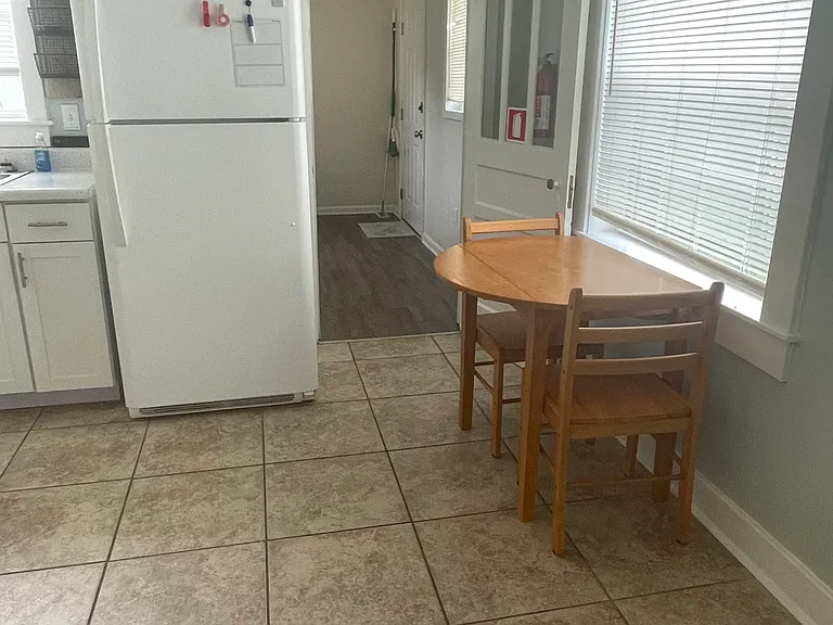 Eat in kitchen, perfect for individual or couple. Door leading to spacious laundry room