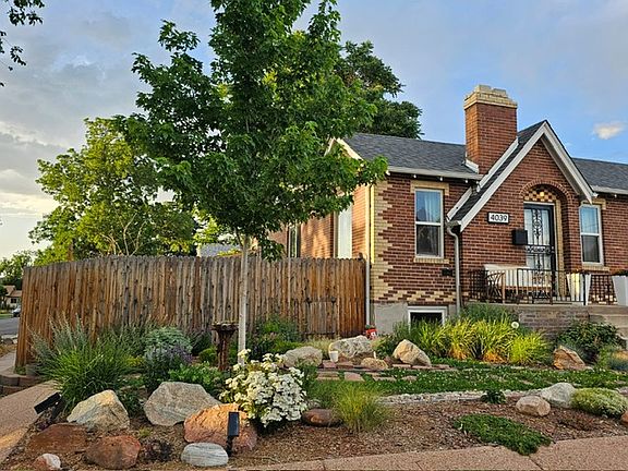 Front exterior and main entrance to home. Faces W 44th Ave.

Waterwise landscaping with TONS of perennials!