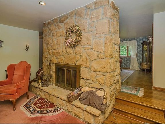 Stone on all sides and steps on either side flow nicely into the dining room.