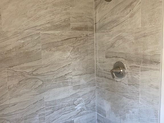 Ceramic tiled shower in Master Bath.