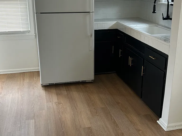 Functional kitchen layout with ample cabinet storage and prep space