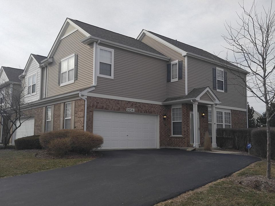 End unit with private driveway.
