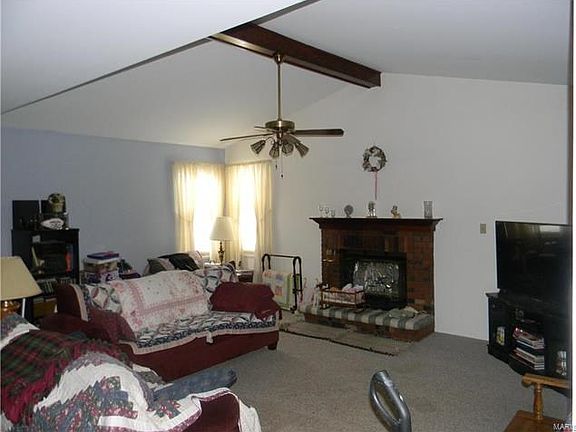 Sunken Great Room w/ Vaulted Ceilings, 1/2 bath and access to backyard