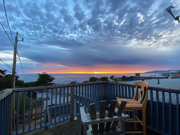 Sunset off the private deck looking up the the Light House