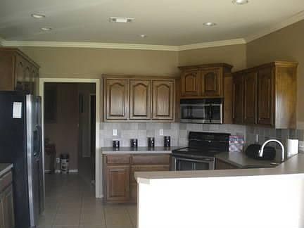 Kitchen View : Lots of counter space, all stainless steel appliances, granite sink