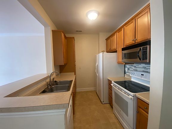 galley kitchen opens to LR