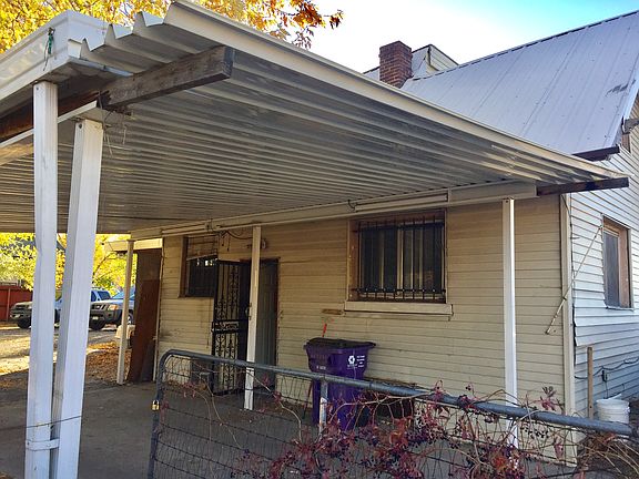 Carport at rear of house