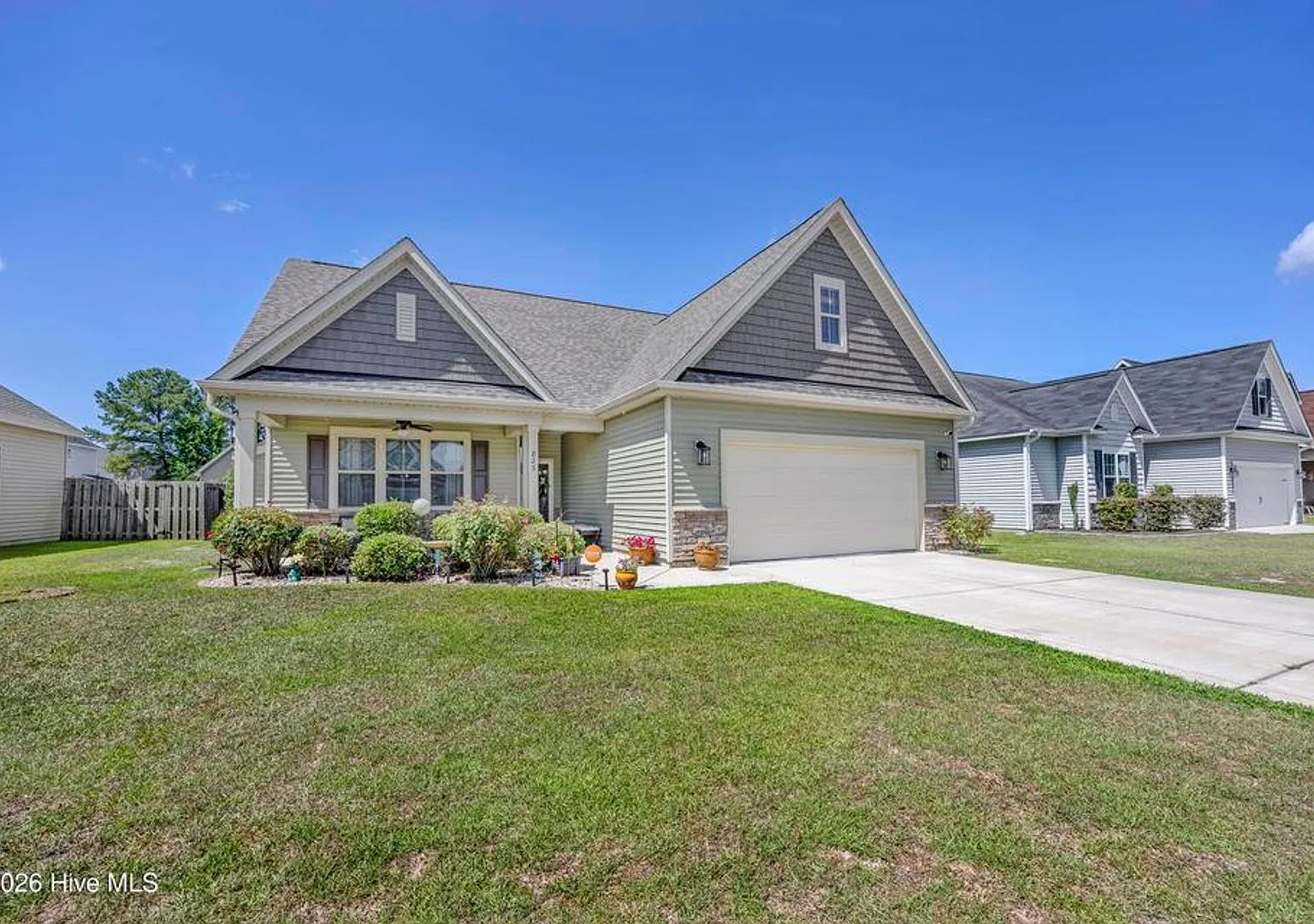 Discover this well-maintained 4-bedroom, 2-bath home in Leland, NC — Photo 1