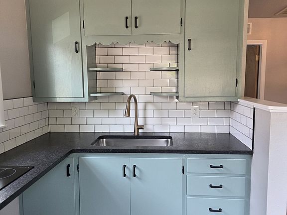Updated kitchen - new counters, new sink, new faucet