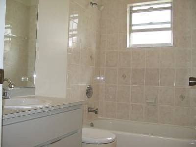 Bathroom with a shower and tub