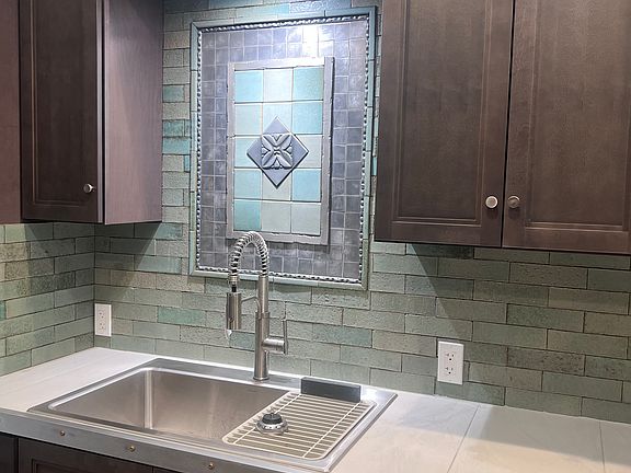 Custom kitchen all brand new appliances 
Custom hand made tile
Very unique and functional