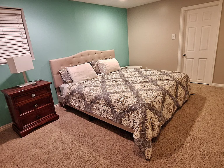Basement bedroom 1 with double closets and en-suite bath