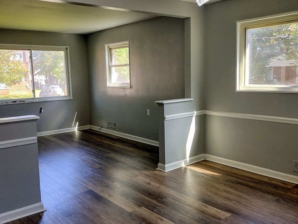 Dining Room with Retro Chandelier and white chair rail on walls