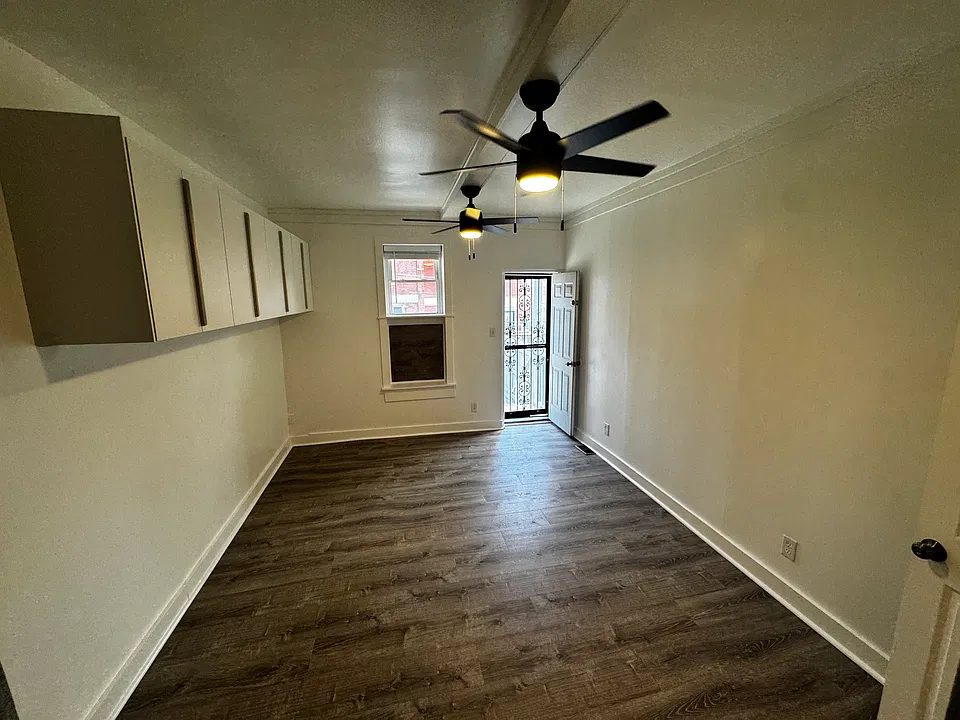 Large bedroom with backdoor