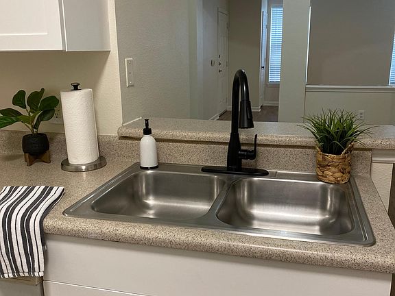 Kitchen is open to dining and living rooms